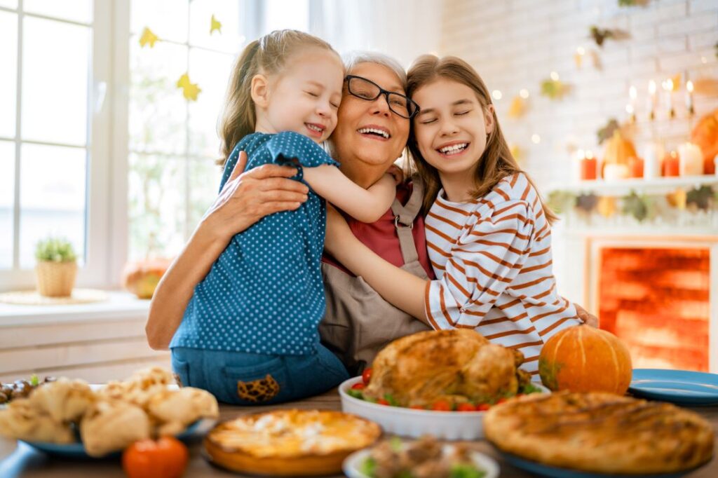 A woman and two children making Thanksgiving dinner.